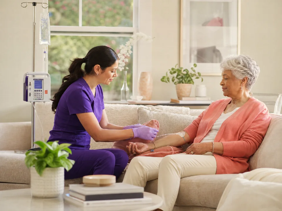 Nurse providing IV medication support at home