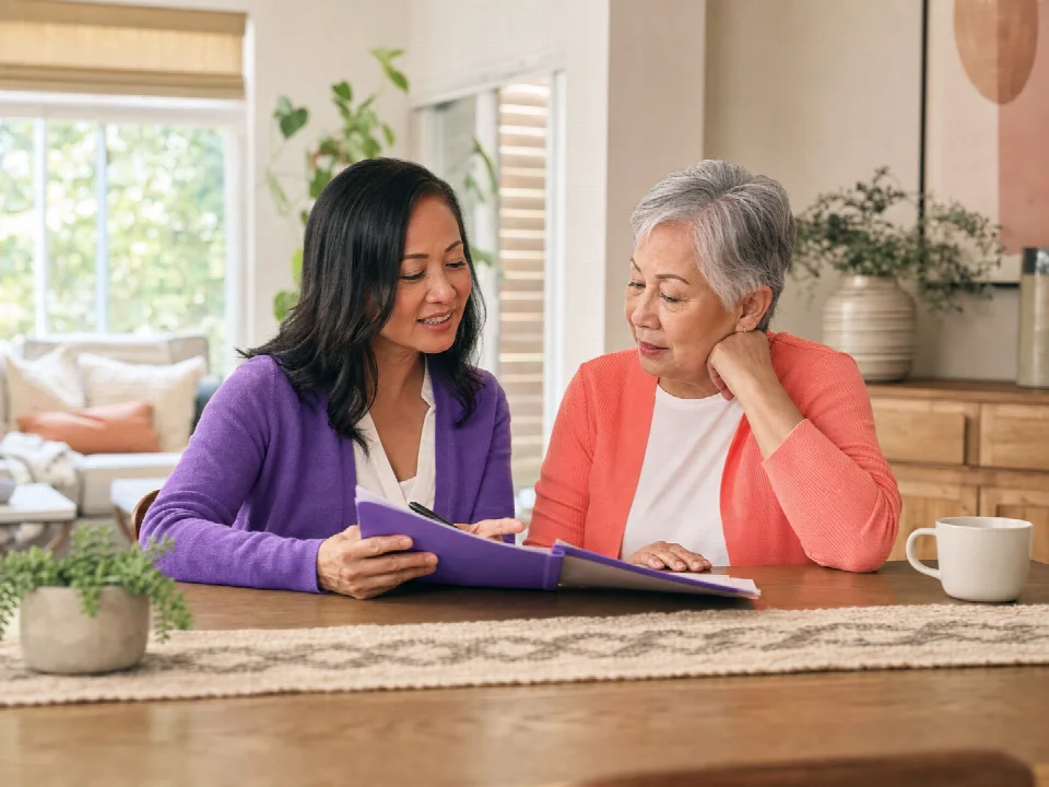 Medical social worker speaking with a patient and family